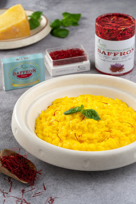 EXOTIC BioNaturals saffron enhances a traditional paella dish with rich hue.