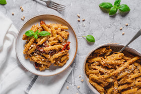 EXPLORE CUISINE Organic Red Lentil Penne bag in pantry, ready-to-use gluten-free base.