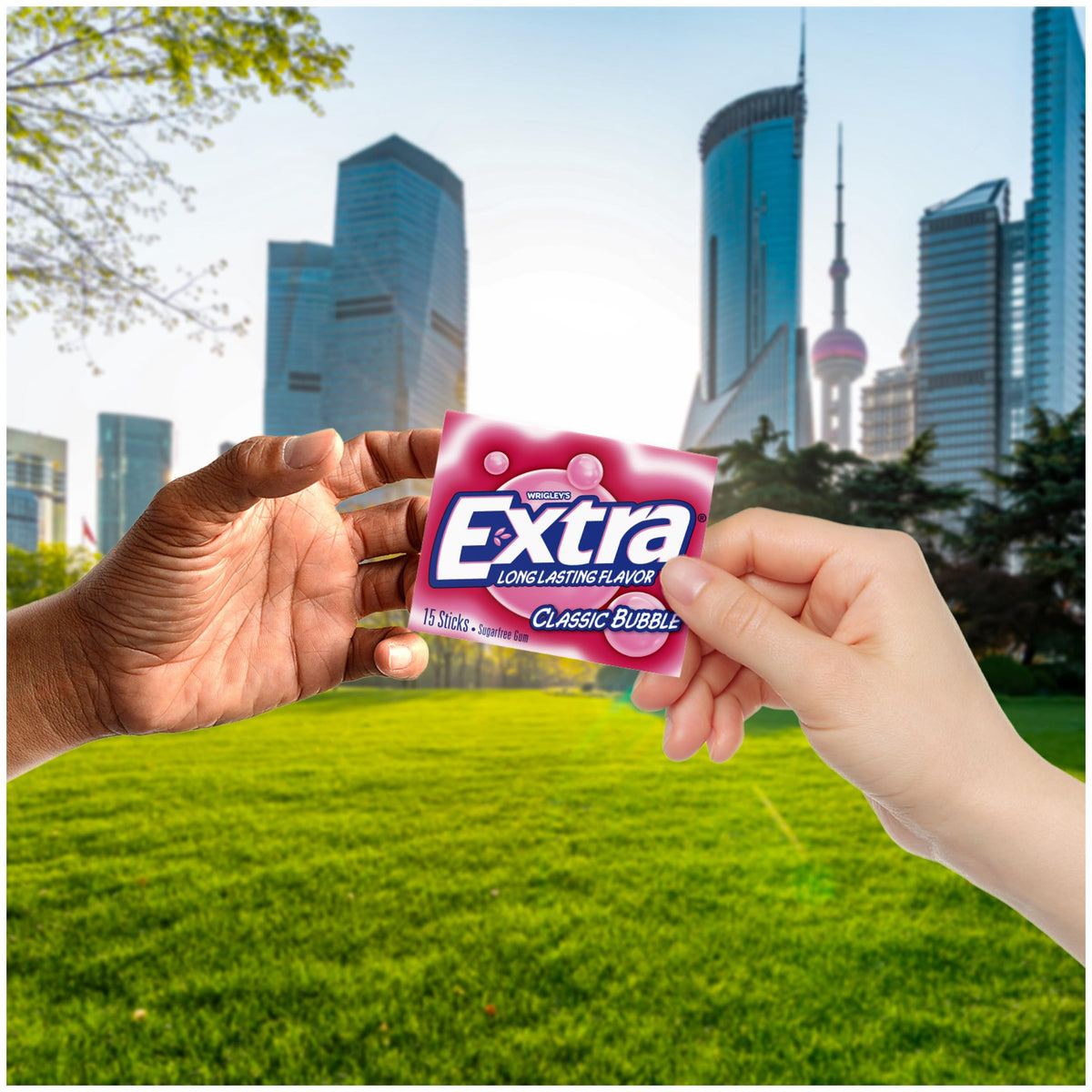 Person chewing EXTRA Classic Bubble Gum for a fresh, nostalgic moment.