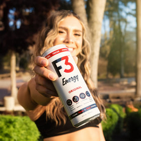 F3 Energy Citrus Clarity can in gym bag signals a focus-boosting break.