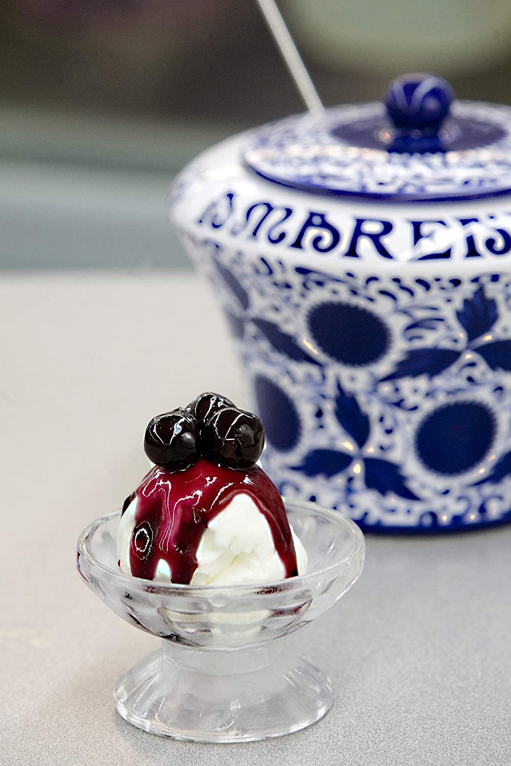 Fabbri Amarena cherries in syrup jar as a premium gelato topping.