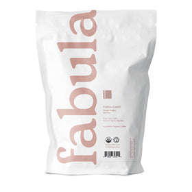 Fabula light roast cup steaming highlights bright acidity and aromatic balance.