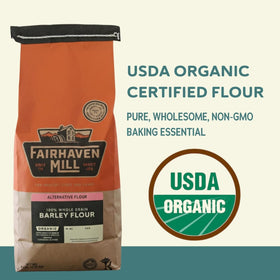 Fairhaven Mill Barley Flour open bag pour, showing light texture ideal for breads