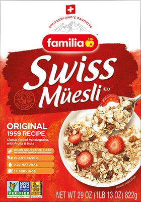 Familia Swiss Muesli ingredients close-up: oats, apples, raisins, nuts for wholesome meals.