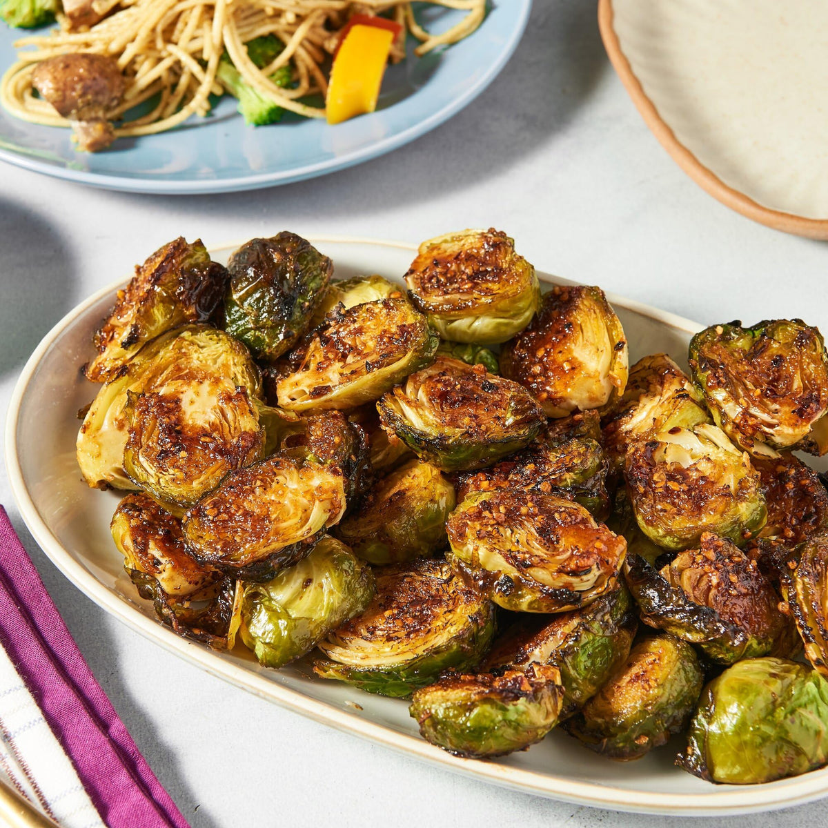 Family dinner scene featuring meals enhanced by the seasoning blend.