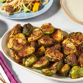 Family dinner scene featuring meals enhanced by the seasoning blend.
