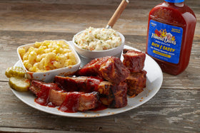 Famous Dave’s Devil's Spit BBQ sauce bottle adds bold heat to grilled chicken