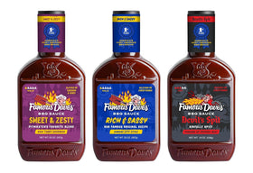 Famous Dave's Devil's Spit bottle in a display boosts bold grilling flavor.