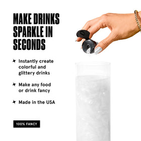 Fancy Sprinkles Diamond White glitter sprinkled into a drink for prismatic glow