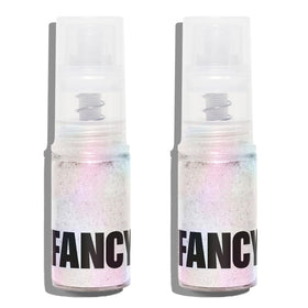 Moonstone glitter spray bottle applying iridescent sparkle to a cake with no added texture