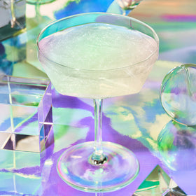 Fancy Sprinkles Moonstone glitter being sprinkled yields iridescent shimmer for two drinks