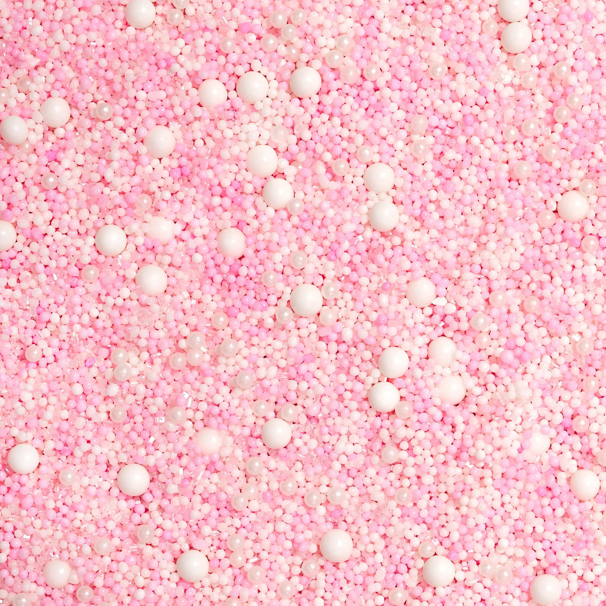Fancy Sprinkles pastel pink and white nonpareils provide festive detail for desserts.