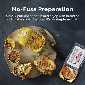 Fangst Regnbue Orred open can on plate, ready to serve with bread.