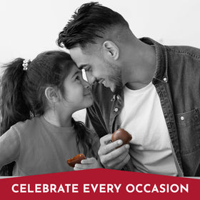 Fannie May Mini Pixies caramel-pecan closeup reveals glossy chocolate and crunchy texture.