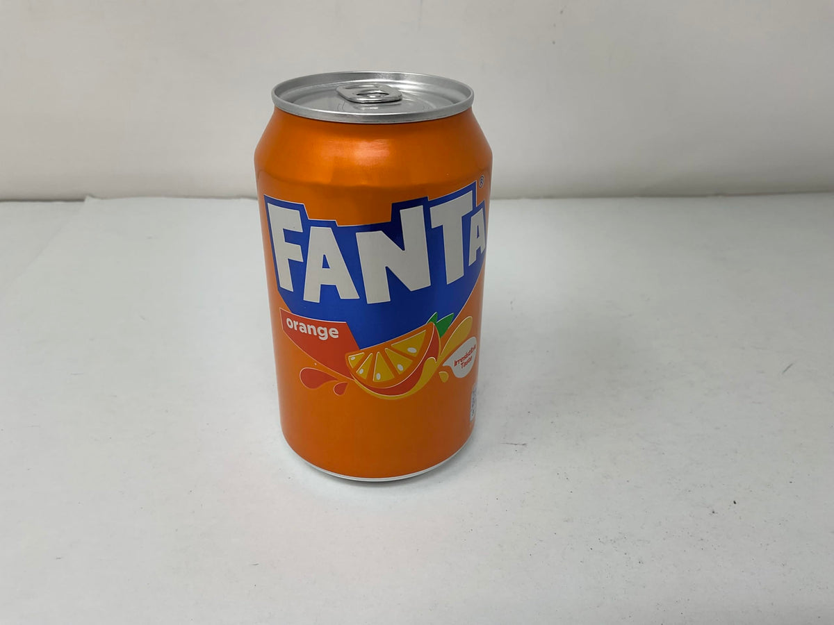 Fanta orange soda in glass with ice for a cool refresh.