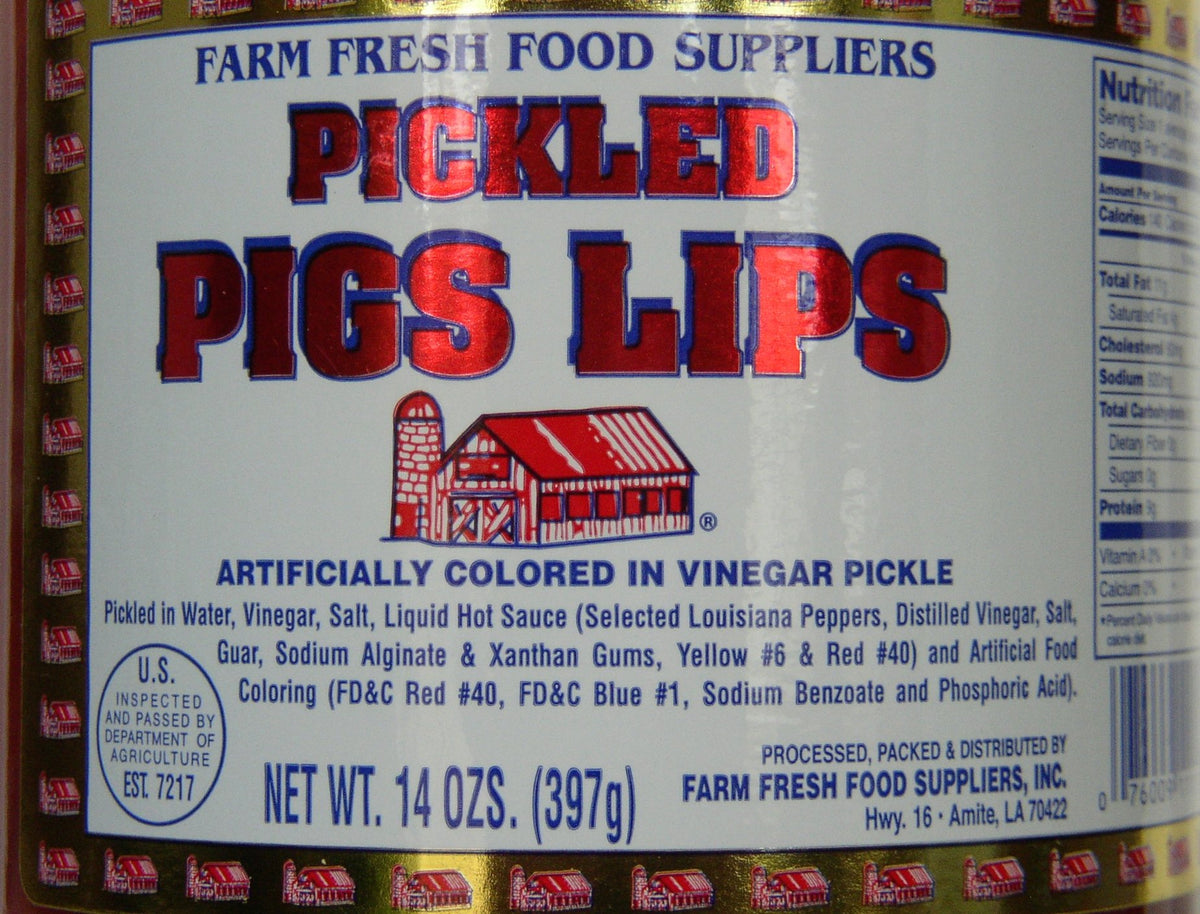Farm Fresh Food Suppliers Pickled Pigs Lips inside jar, vivid slices in brine ideal for bold tasting moments.