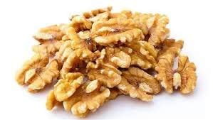 Walnuts sprinkled on ice cream by Farm Fresh Nuts for extra crunch.