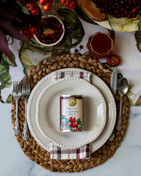 Table setting featuring FARMER'S MARKET sauce as a festive holiday side.