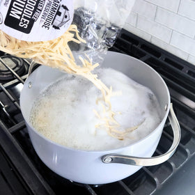 Amish tradition process scene showing Farmhouse Preserve noodles' hand-crafted quality.