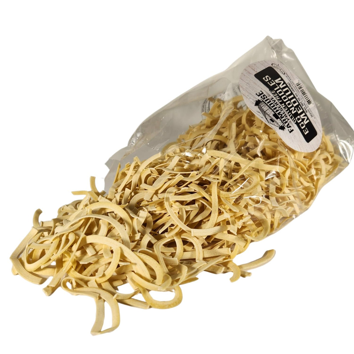 Farmhouse Preserve double egg yolk noodles on cutting board, ideal for weeknight meals.