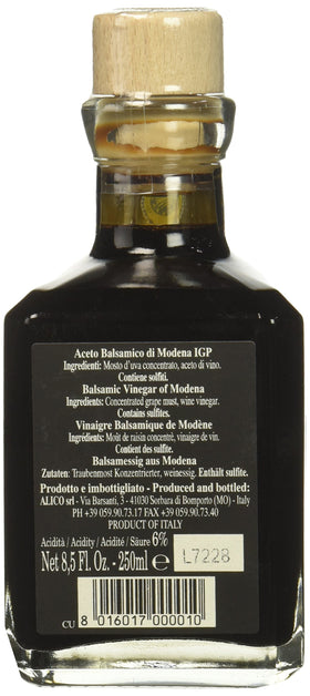 Fattoria Estense Gold Label balsamic being poured as a glaze on food