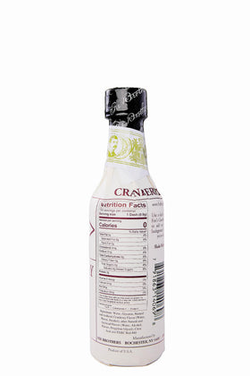 Fee Brothers Cranberry Bitters bottle pouring for versatile festive drinks