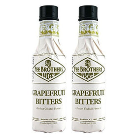 Fee Brothers Grapefruit Bitters bottle close-up highlighting citrus aroma for cocktails.