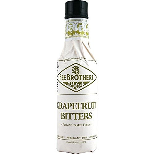 Fee Brothers Grapefruit Bitters being poured to brighten a mixed drink.