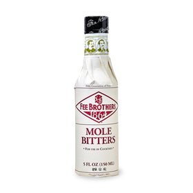 Fee Brothers Mole Bitters bottle closeup highlighting cacao-inspired aroma for cocktails.