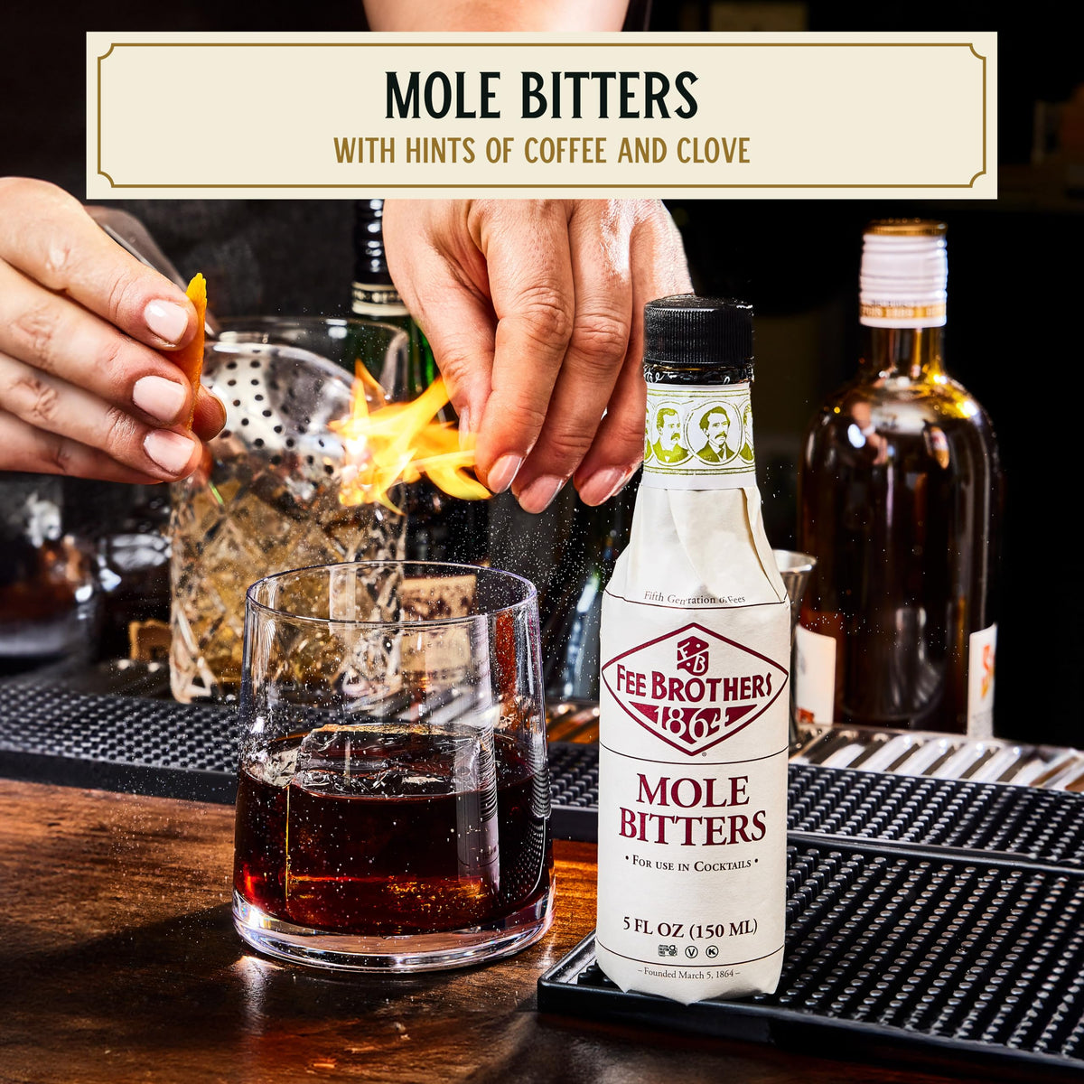 Fee Brothers Mole Bitters bottle pour shown for balancing whiskey cocktails.