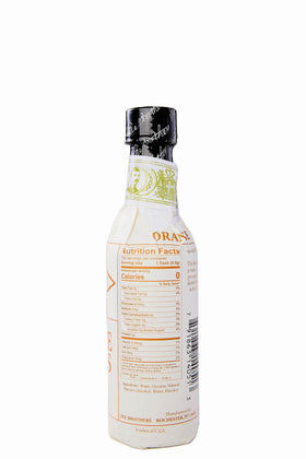 Fee Brothers West Indian Orange Bitters bottle closeup highlights rich citrus aroma.