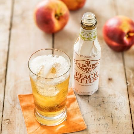 Fee Brothers Peach Bitters drops in a cocktail, adding aroma and balance.