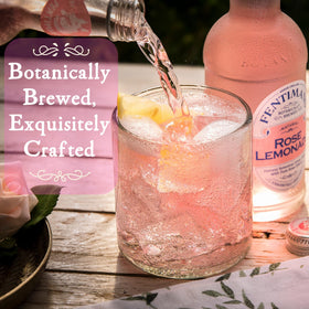 Chilled glass of Fentimans Sparkling Rose Lemonade with ice, refreshing and bright