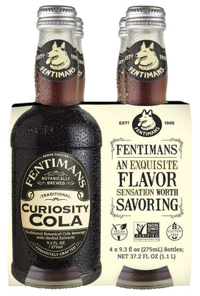 Fentimans Sparkling Curiosity Cola 4-pack on a kitchen counter, ideal for entertaining.