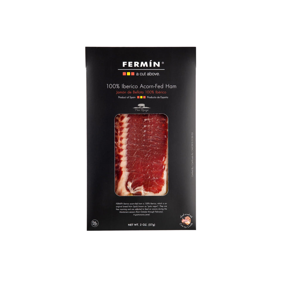 FERMIN Iberico Bellota ham slice on board highlights premium texture for tapas