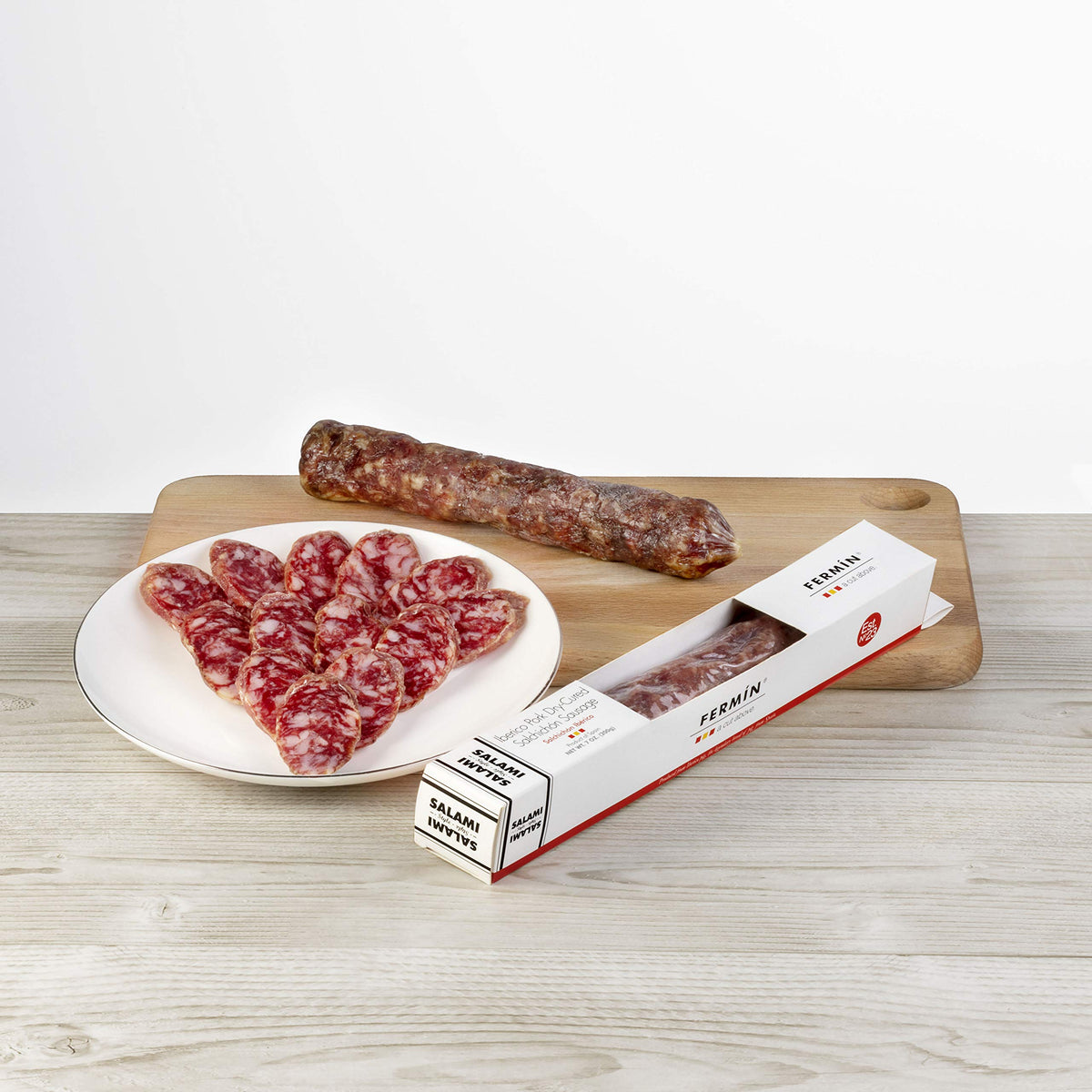 Sliced Fermin Salchichon on a charcuterie board, perfect for tapas nights.