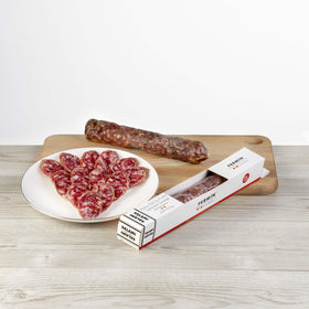 Sliced Fermin Salchichon on a charcuterie board, perfect for tapas nights.