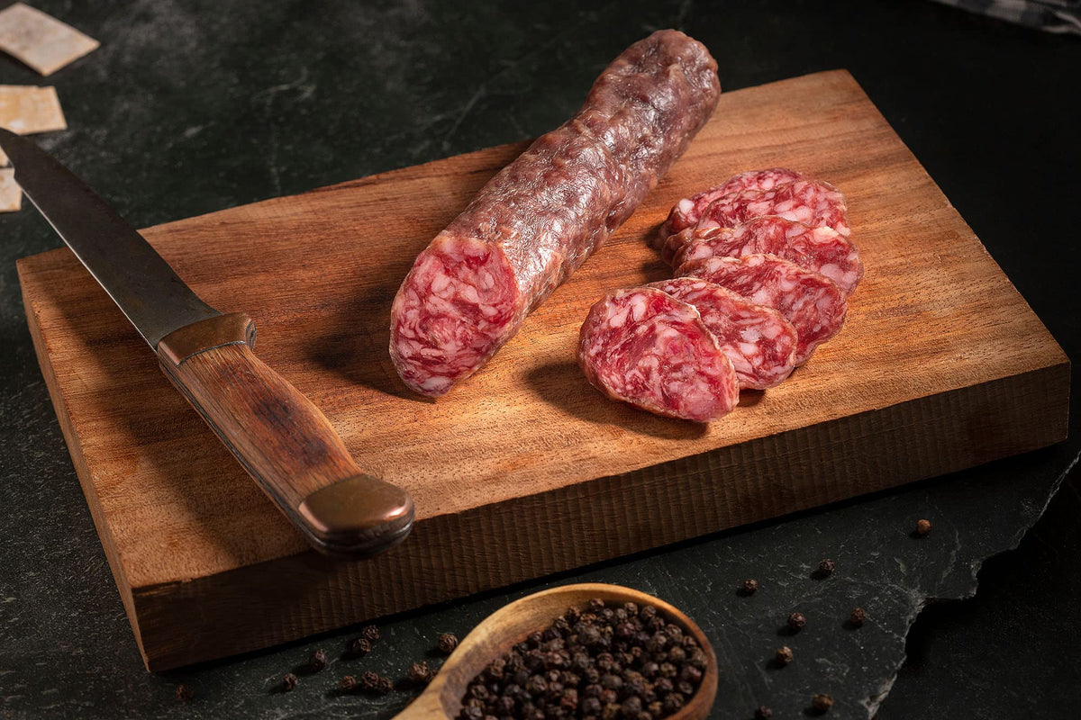 Slicing Fermin Salchichon demonstrates ready-to-serve options for hosts.