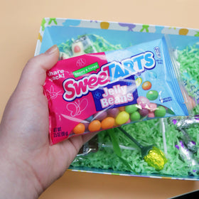 Ferrara SweeTarts Jelly Beans close-up glossy shells highlighting tart flavor.