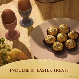 Close-up of Ferrero Rocher golden wrapper highlighting luxury hazelnut chocolate.