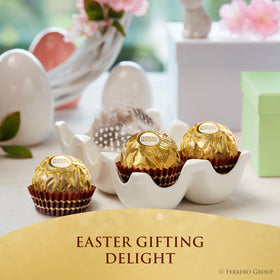 Gift box opens to reveal premium chocolates for sharing moments.