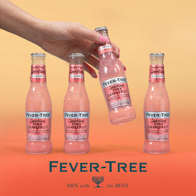 Fever-Tree pairing setup with glass and lime, showcasing versatile mixer options.