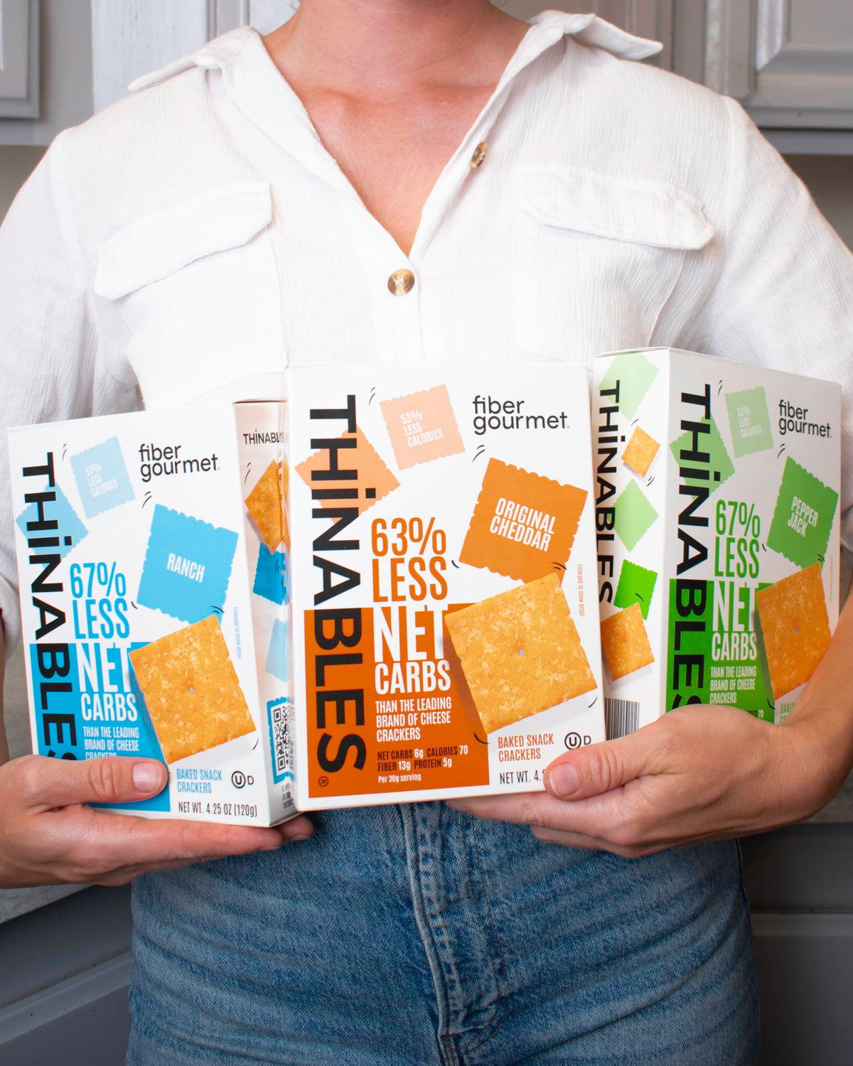 Fiber Gourmet Thinables three-flavor bundle box close-up showing variety for snacking.