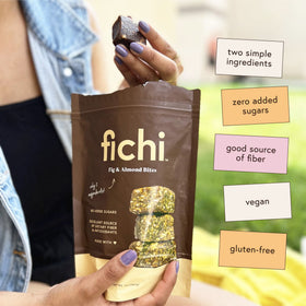 Fichi bites in a glass jar on a wooden table; convenient gluten-free snack option.