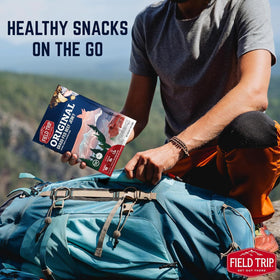 Field Trip Beef Jerky Original packaging in hand for grab-and-go.