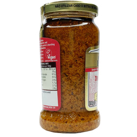 Filippo Berio pesto ingredient closeup shows sun-dried tomatoes and herbs for depth.