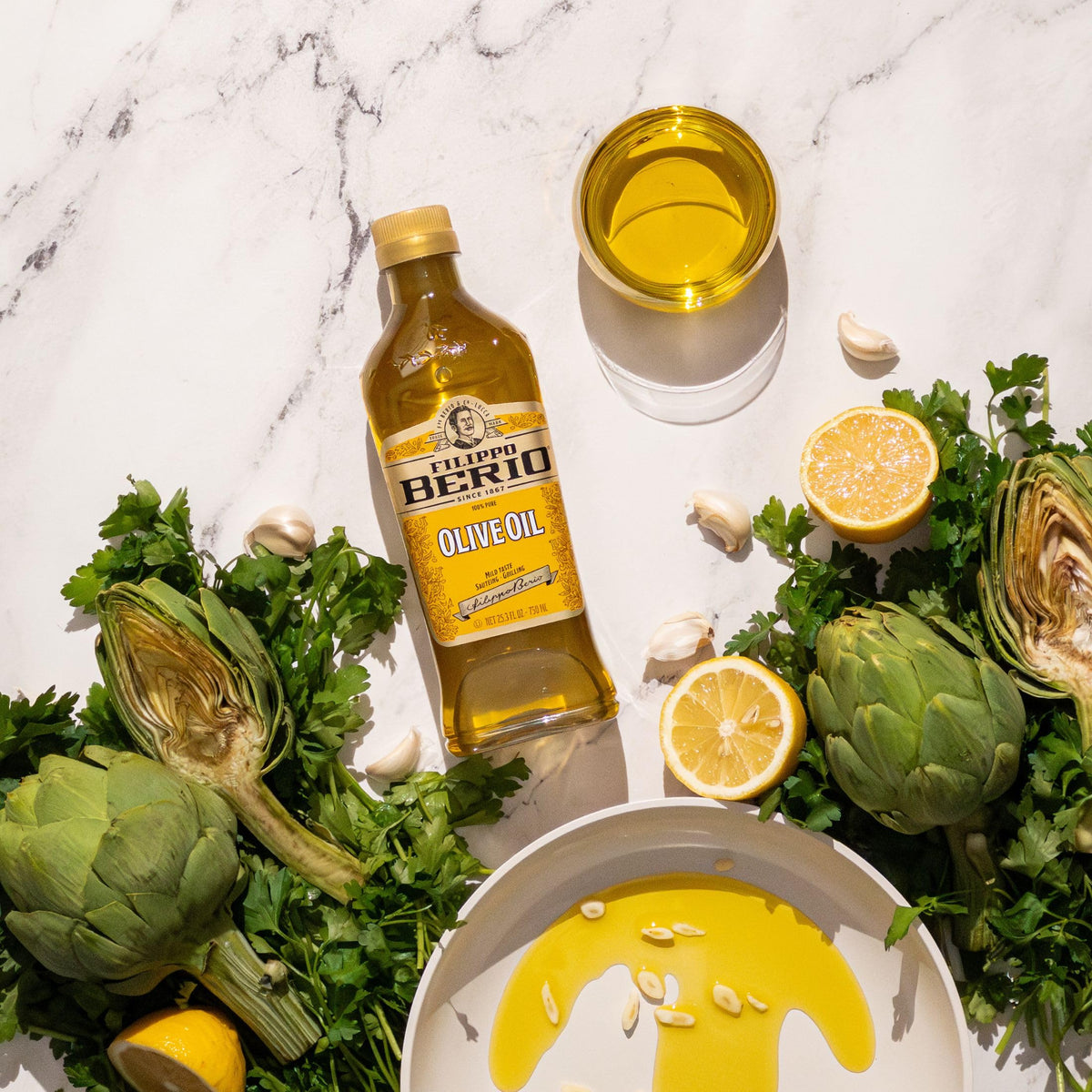 Filippo Berio Pure Olive Oil bottle shown with sustainable features and recycled content