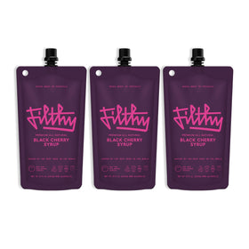 Filthy Food black cherry syrup bottle shows all-natural ingredients for rich cocktails.