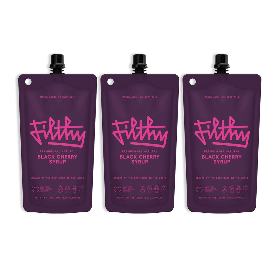 Filthy Food black cherry syrup bottle shows all-natural ingredients for rich cocktails.