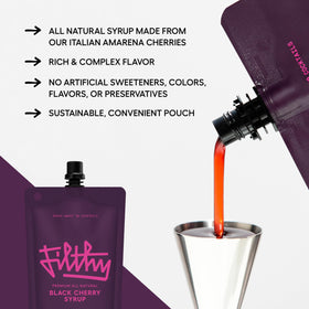 Glass with Filthy Food black cherry syrup cocktail, showcasing bold cherry color.